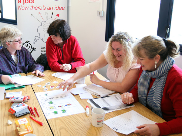 group of ladies working together in a workshop